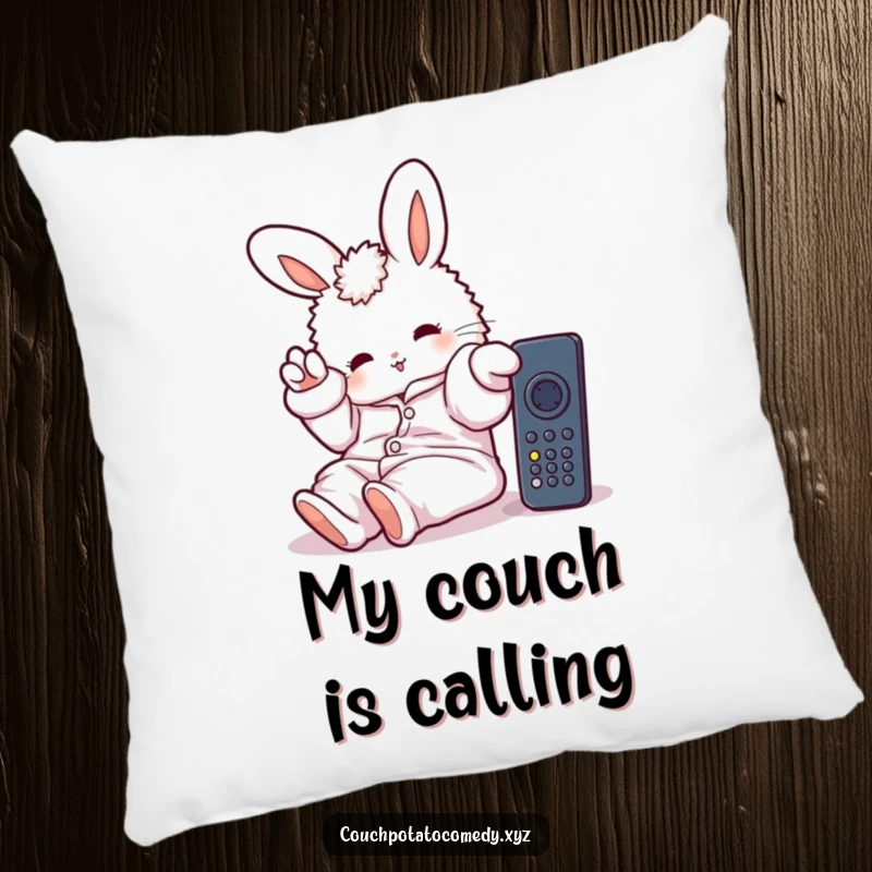 Funny pillow featuring a fluffy bunny in oversized pajamas, lazily stretching a paw towards a remote, soft and humorous home decor.
